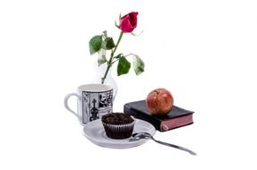still life with book, vase with rose and chocolate cake