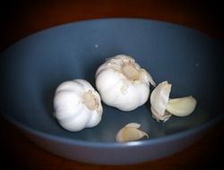 Two white garlic in a plate