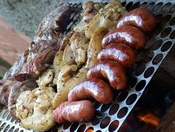 shish kebab and sausages on the barbecue grill