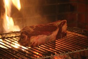 barbecue grill steak on fire