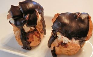 chocolate cream puff with whipped cream