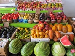 watermelons and fruits on farmers market