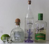 alcoholic drinks in different glass bottles