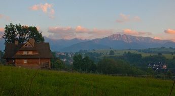 village in mountain valley at spring evening, scenery landscape