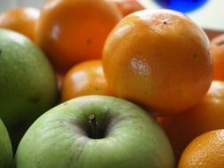 green and yellow fruits, apples and clementines