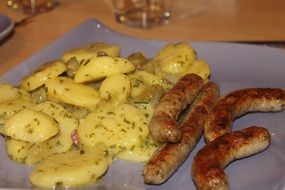 potatoes and sausages on a plate