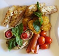 cold appetizers on a white plate