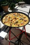 spanish paella on the pan outside