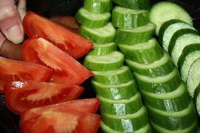 fresh sliced tomatoes and cucumbers