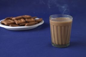 cookies on the plate and hot chocolate on the table