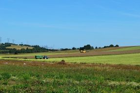 combines harvesting corn