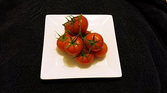 tomatoes on a white plate