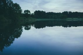 glassy lake in the calm evening