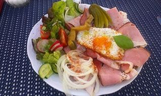 vegetables and meat and bread on a plate