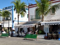 Different colorful street cafes