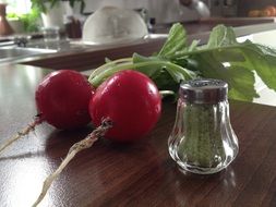 two red radishes on the table