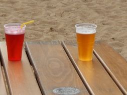 glasses with drinks on a wooden table