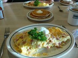 omelette and pancakes on table