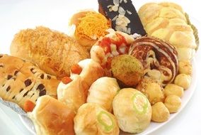 variety of bread snacks on a white plate close up