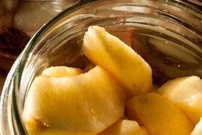 sliced apple in a glass jar