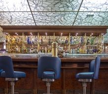 Blue chairs near bar in the restaurant