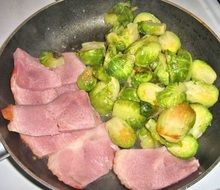 brussel sprouts and garlic in a frying pan