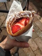 french dessert with fruit in hand close up