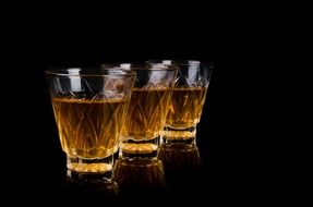 three glasses of whiskey