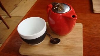 red teapot and striped cup