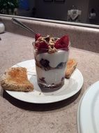 healthy breakfast, yogurt with cereals and fruits