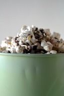 popcorn in a green bowl