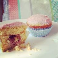 muffins with jam on a plate