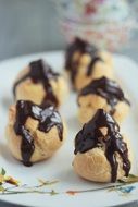 tasty sweet profiteroles close-up