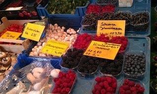 large selection of berries, fruits and vegetables in the farmers local market