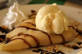 pancake and ice cream crepe on a plate