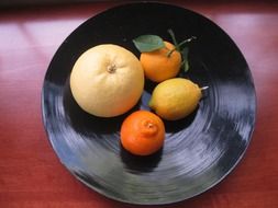 citrus on a black plate