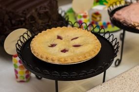 cherry pie on vintage stand
