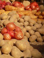 potatoes and onions on the shop counter