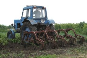 Blue tractor of farmer