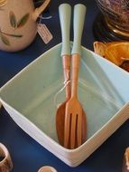 Bowl with wooden spoon and fork