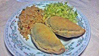 pies with a side dish on a plate