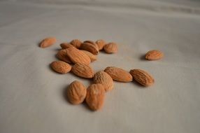 almonds nuts on white table