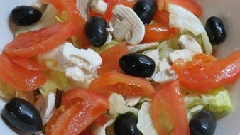 salad with olives, tomatoes and mushrooms