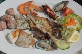 seafood and colorful vegetables on plate