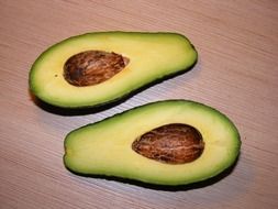 avocado in sectional on a wooden surface