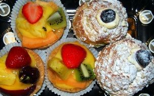 cupcakes with cream in paper cups