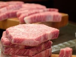 raw kobe beef steaks at a restaurant in Japan