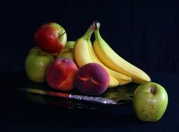 Green and red apples,bananas and peaches