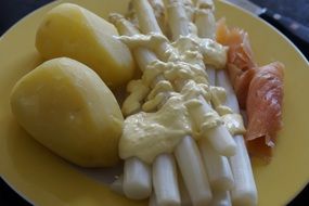 asparagus, potato and salmon on a plate