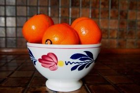 mandarin fruit in colorful ceramics